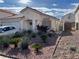 Charming single-story home with a two-car garage, desert landscaping, and neutral paint enhancing its curb appeal at 3673 Spring Day Ct, Las Vegas, NV 89147