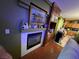 Cozy living room with a modern fireplace and a view of the adjacent dining area creating an inviting atmosphere at 3673 Spring Day Ct, Las Vegas, NV 89147