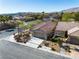 Single-story home featuring a tile roof, a two-car garage, and neat landscaping in a suburban neighborhood at 3685 Australian Cloud Dr, Las Vegas, NV 89135