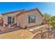Backyard featuring a concrete patio, outdoor seating, and desert landscaping at 3685 Australian Cloud Dr, Las Vegas, NV 89135
