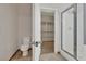 Bathroom featuring a toilet, glass-enclosed shower, and a walk-in closet at 3685 Australian Cloud Dr, Las Vegas, NV 89135