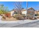 View of a charming single-story home with mature landscaping and a tile roof at 3685 Australian Cloud Dr, Las Vegas, NV 89135