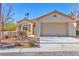 Charming single-story home features a two-car garage and low maintenance desert landscaping at 3685 Australian Cloud Dr, Las Vegas, NV 89135