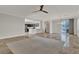 Bright living area with an open layout, tile flooring, recessed lighting, and backyard access at 3685 Australian Cloud Dr, Las Vegas, NV 89135