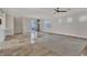 Spacious living area with tile flooring, recessed lights, and sliding glass doors to the patio at 3685 Australian Cloud Dr, Las Vegas, NV 89135