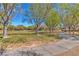Enjoy this park view with a walking path, lush green grass, and mature trees, perfect for outdoor activities at 3685 Australian Cloud Dr, Las Vegas, NV 89135