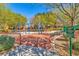 Playground with swings, benches, and signage for rules at 3685 Australian Cloud Dr, Las Vegas, NV 89135