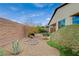 Beautifully landscaped backyard with desert plants and accent stones and fire pit at 3717 Rocklin Peak Ave, North Las Vegas, NV 89081