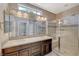 Modern bathroom featuring a double sink vanity and glass-enclosed shower at 3717 Rocklin Peak Ave, North Las Vegas, NV 89081