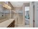 Modern bathroom featuring a glass shower, vanity with sink, and tiled floor at 3717 Rocklin Peak Ave, North Las Vegas, NV 89081