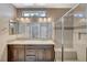 Modern bathroom featuring a double sink vanity and glass-enclosed shower at 3717 Rocklin Peak Ave, North Las Vegas, NV 89081