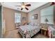 Well-lit bedroom with carpet, a ceiling fan, a window and accent furnishings at 3717 Rocklin Peak Ave, North Las Vegas, NV 89081