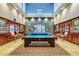 Billiard room with pool tables, stylish lighting, and decorative mirrors at 3717 Rocklin Peak Ave, North Las Vegas, NV 89081