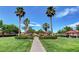 Palm trees accent the multiple park shelters and paved walkways within this community green space at 3717 Rocklin Peak Ave, North Las Vegas, NV 89081