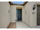 Inviting front entry with an arched entryway and security door at 3717 Rocklin Peak Ave, North Las Vegas, NV 89081