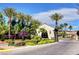 Elegant building entrance framed by lush landscaping and mature palm trees at 3717 Rocklin Peak Ave, North Las Vegas, NV 89081