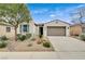 Charming home with a two-car garage, desert landscaping and a well-maintained front yard at 3717 Rocklin Peak Ave, North Las Vegas, NV 89081