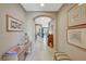 Hallway with tiled flooring and art-adorned walls leading into the rest of the home at 3717 Rocklin Peak Ave, North Las Vegas, NV 89081