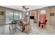 Comfortable living room with ceiling fan, sofa, and sliding glass doors to the outside at 3717 Rocklin Peak Ave, North Las Vegas, NV 89081