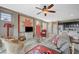 Spacious living room with fan and access to the kitchen and outdoor patio at 3717 Rocklin Peak Ave, North Las Vegas, NV 89081