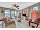 Bright living room with ceiling fan, plush seating, and outdoor access at 3717 Rocklin Peak Ave, North Las Vegas, NV 89081