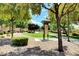 Scenic neighborhood park with mature trees, manicured landscaping, and a walking path at 3717 Rocklin Peak Ave, North Las Vegas, NV 89081