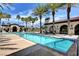 Inviting swimming pool surrounded by lounge chairs and lush landscaping, perfect for relaxation at 3717 Rocklin Peak Ave, North Las Vegas, NV 89081