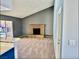 Spacious living room with carpeted floors and a brick fireplace, perfect for cozy gatherings at 3729 La Junta Dr, Las Vegas, NV 89120