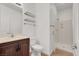 Bathroom featuring a vanity with marble countertop and a walk-in shower at 4036 W Bird Man Ln, North Las Vegas, NV 89084