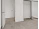 Neutral bedroom features a sliding closet door and plush carpeting at 4036 W Bird Man Ln, North Las Vegas, NV 89084