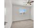 Bedroom is bathed in natural light, showcasing a window with white shutters and ceiling fan at 4036 W Bird Man Ln, North Las Vegas, NV 89084