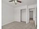 Bedroom featuring closet doors and ceiling fan, enhancing space and reflecting light in the room at 4036 W Bird Man Ln, North Las Vegas, NV 89084