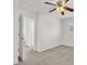 Spacious carpeted bedroom featuring a ceiling fan and a shuttered window at 4036 W Bird Man Ln, North Las Vegas, NV 89084