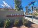 Attractive community sign for La Vella, with lush landscaping and desert hues in a sunny location at 4036 W Bird Man Ln, North Las Vegas, NV 89084