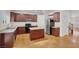 Bright open kitchen featuring stainless appliances, dark cabinetry, and modern countertops at 4036 W Bird Man Ln, North Las Vegas, NV 89084