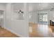 Open-concept living area with bright lighting and modern kitchen access at 4036 W Bird Man Ln, North Las Vegas, NV 89084