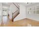 Living room with polished floors and a staircase in view at 4036 W Bird Man Ln, North Las Vegas, NV 89084