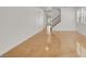 Spacious living room area with a staircase and polished floors at 4036 W Bird Man Ln, North Las Vegas, NV 89084