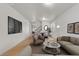 A bright living room with a staircase leading to a dining space at 4036 W Bird Man Ln, North Las Vegas, NV 89084