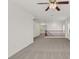 Spacious loft area with neutral carpet and ceiling fan at 4036 W Bird Man Ln, North Las Vegas, NV 89084