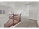 Upstairs loft featuring carpet floors, wood railing and bright light at 4036 W Bird Man Ln, North Las Vegas, NV 89084