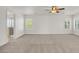 Open loft area features carpet floors and bright windows at 4036 W Bird Man Ln, North Las Vegas, NV 89084