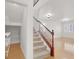 Carpeted staircase near a closet and view of the living room at 4036 W Bird Man Ln, North Las Vegas, NV 89084