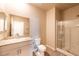 Bathroom featuring a granite countertop, a white cabinet, and a glass shower at 480 Silverweed Ave, Henderson, NV 89044