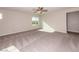 Bright bedroom featuring a ceiling fan and large window with natural light at 480 Silverweed Ave, Henderson, NV 89044