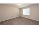 Neutral bedroom with plush carpet, window with blinds, and electrical outlets at 480 Silverweed Ave, Henderson, NV 89044