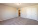 Spacious carpeted bedroom with ample closet space and neutral color scheme at 480 Silverweed Ave, Henderson, NV 89044