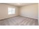 Carpeted bedroom with a large window providing natural light and great views at 480 Silverweed Ave, Henderson, NV 89044