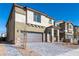 Charming two-story home with a two-car garage and stone veneer accents at 480 Silverweed Ave, Henderson, NV 89044