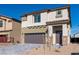 Charming two-story home featuring a two-car garage, stone accents, and a well-maintained front yard at 480 Silverweed Ave, Henderson, NV 89044